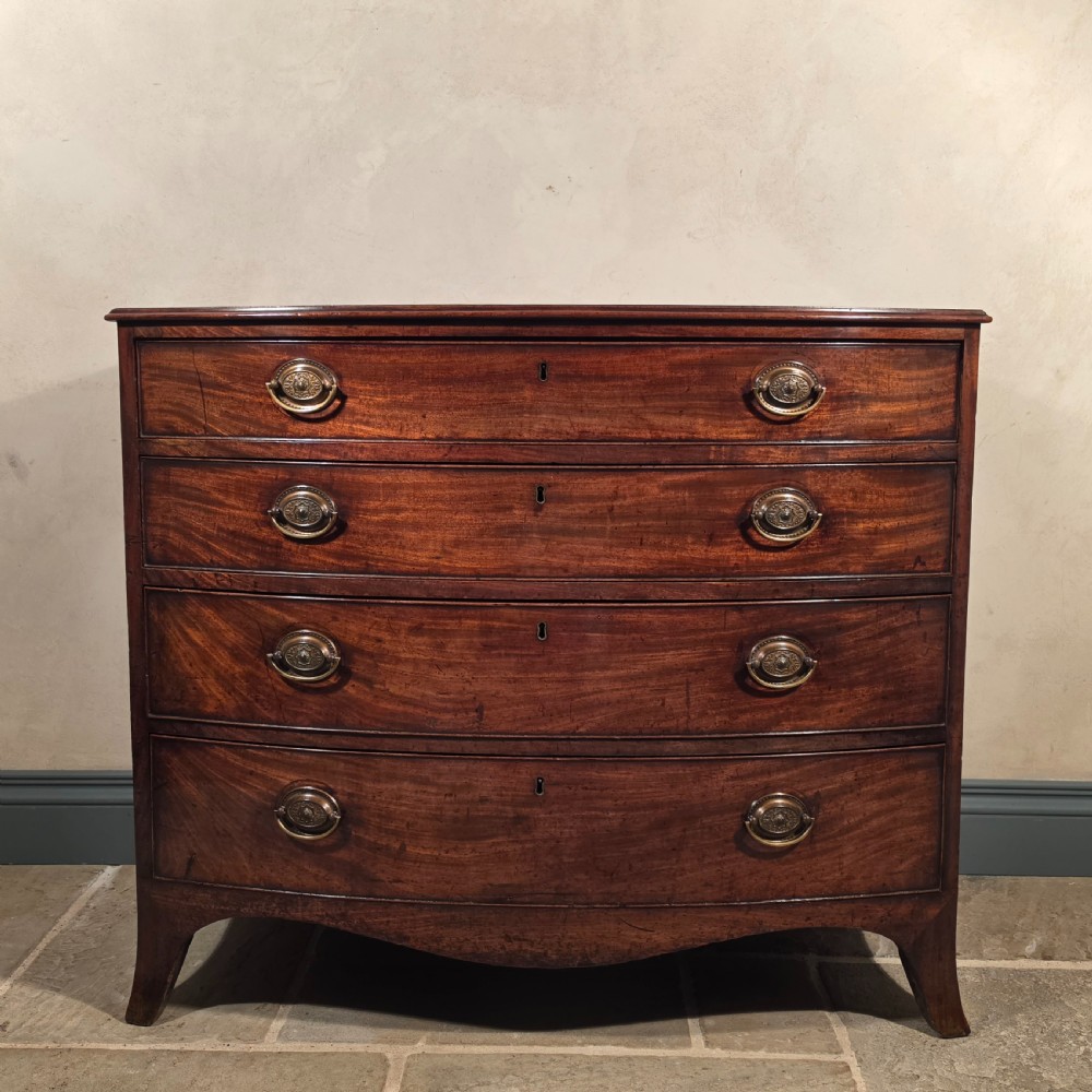 A Georgian bow front chest of drawers.  View III