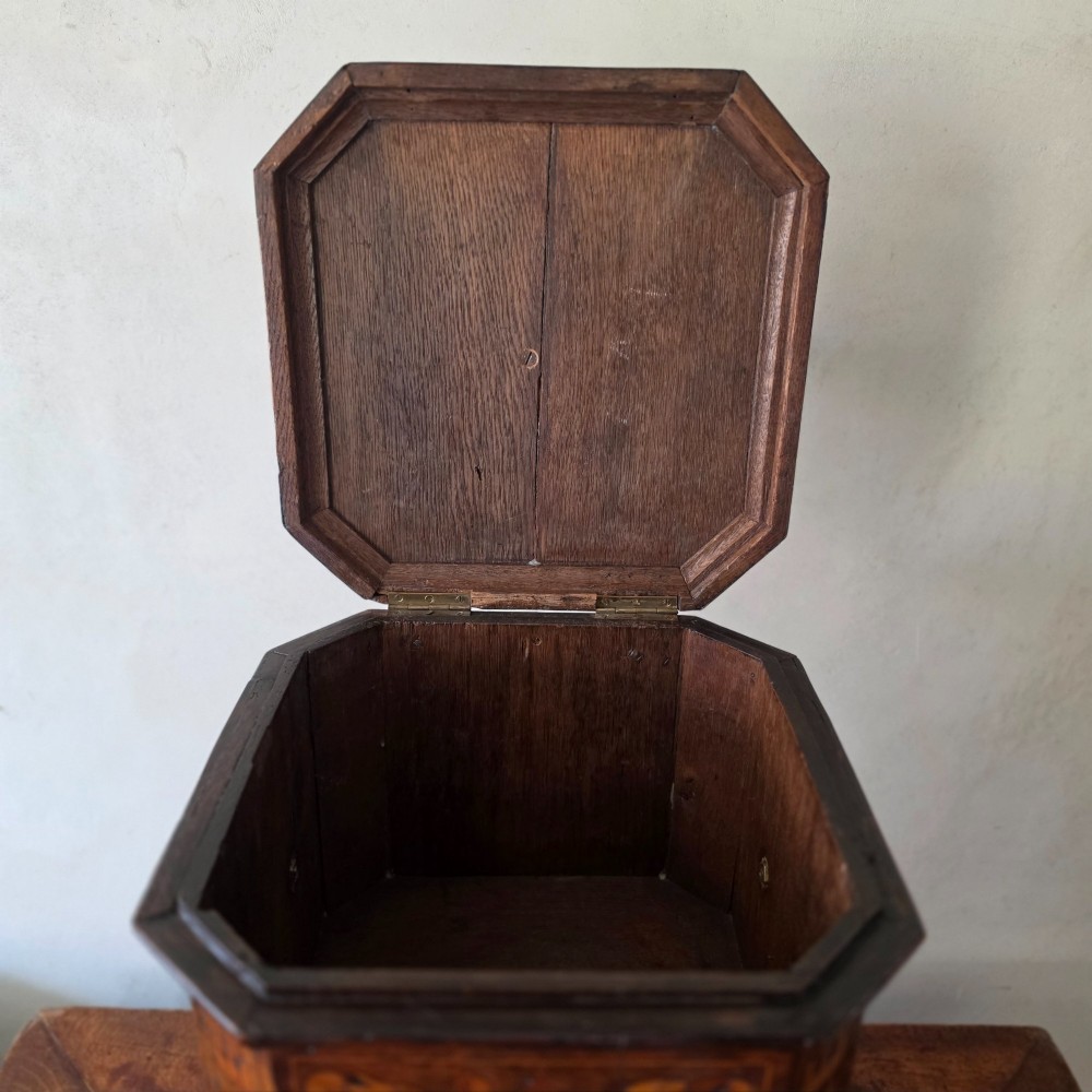 An 18th century marquetry wine cooler. View IX