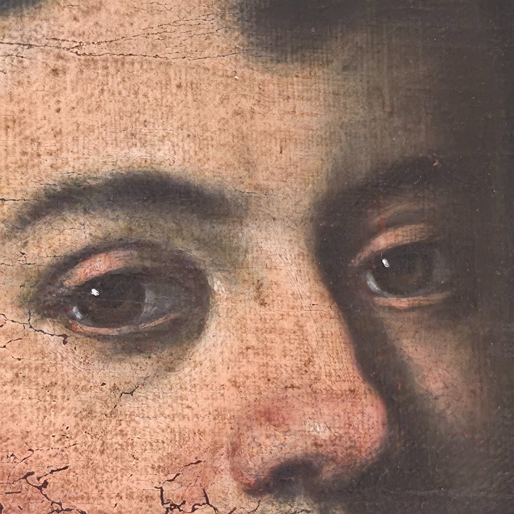 An antique oil painting depicting a 17th-century gentleman with dark hair and a white collar, presented in a dark ebonised frame. View VIII