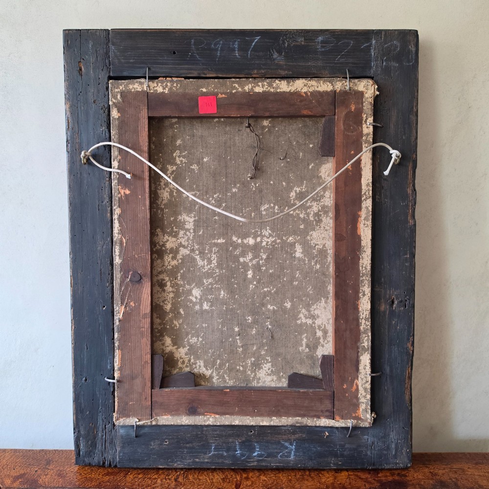 An antique oil painting depicting a 17th-century gentleman with dark hair and a white collar, presented in a dark ebonised frame. View X