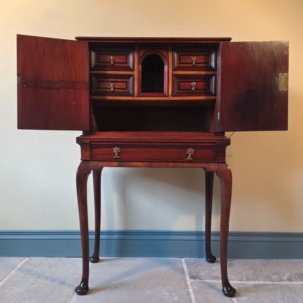 An 18th-century dark wood cabinet on stand featuring twin doors with black diamond inlay, a single lower drawer, and slender cabriole legs. View II