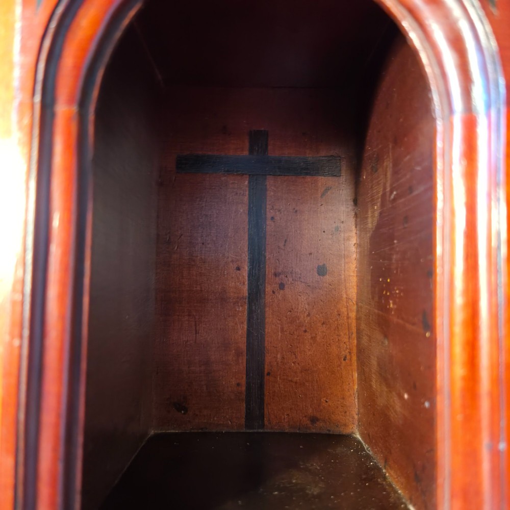 An 18th-century dark wood cabinet on stand featuring twin doors with black diamond inlay, a single lower drawer, and slender cabriole legs. View VI