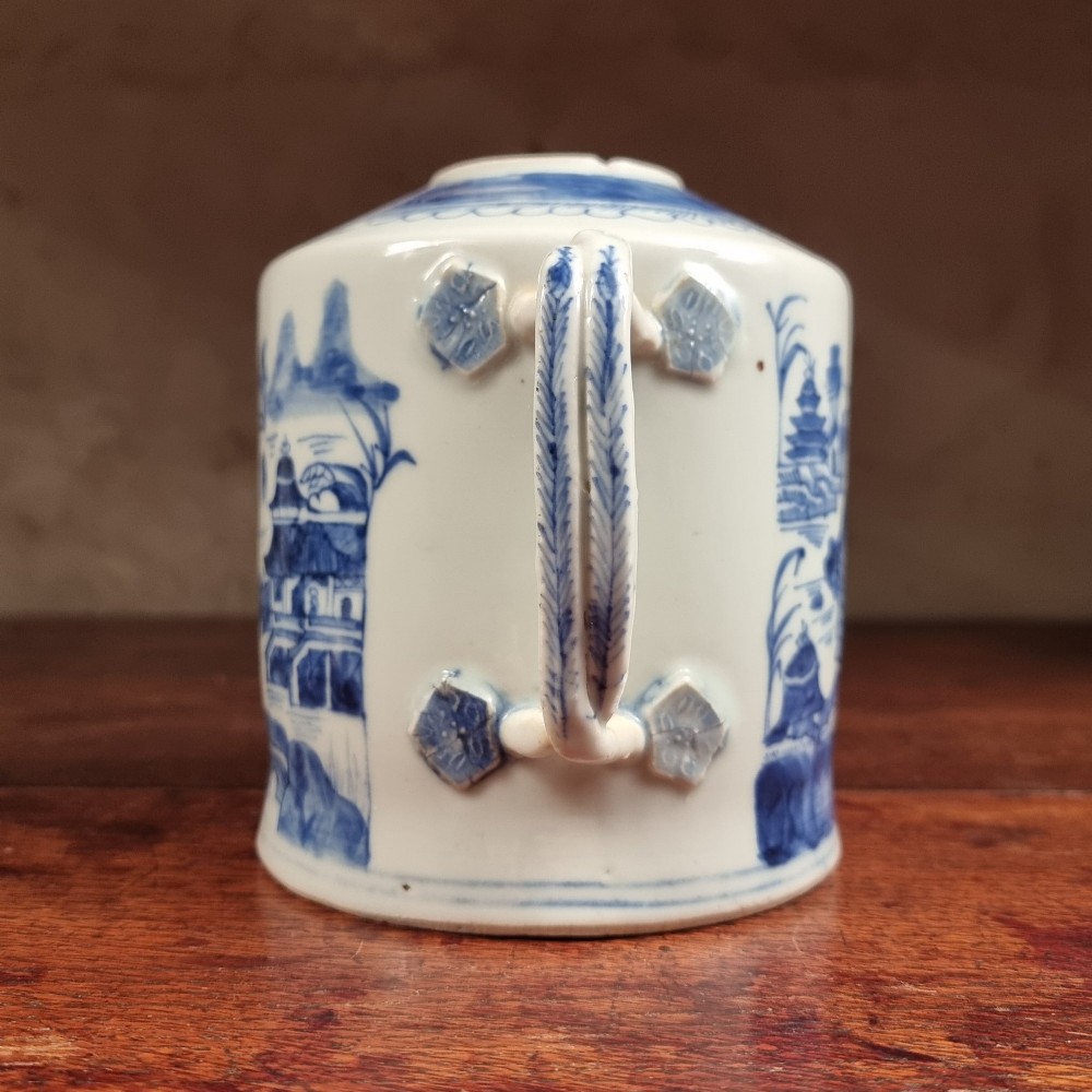 A cylindrical late 18th-century Chinese export porcelain teapot decorated with hand-painted blue and white underglaze river landscape scenes. View V