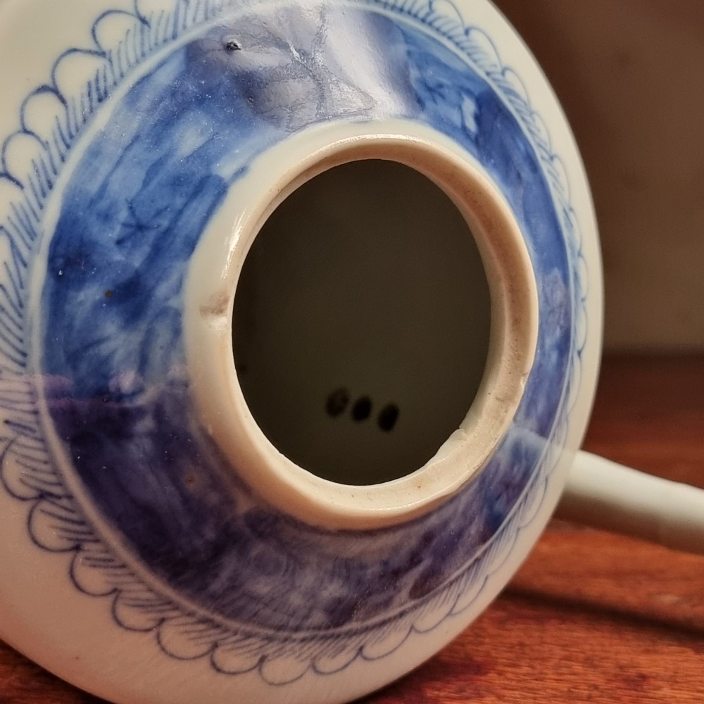 A cylindrical late 18th-century Chinese export porcelain teapot decorated with hand-painted blue and white underglaze river landscape scenes. View VI