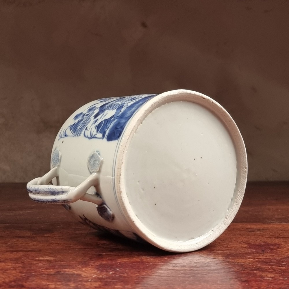 A cylindrical late 18th-century Chinese export porcelain teapot decorated with hand-painted blue and white underglaze river landscape scenes. View VII