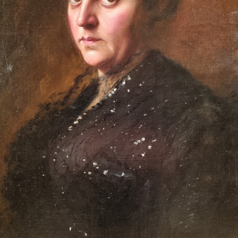 An Edwardian oil portrait of a lady framed in a wide burr wood moulding with a gilded inner border. View IV