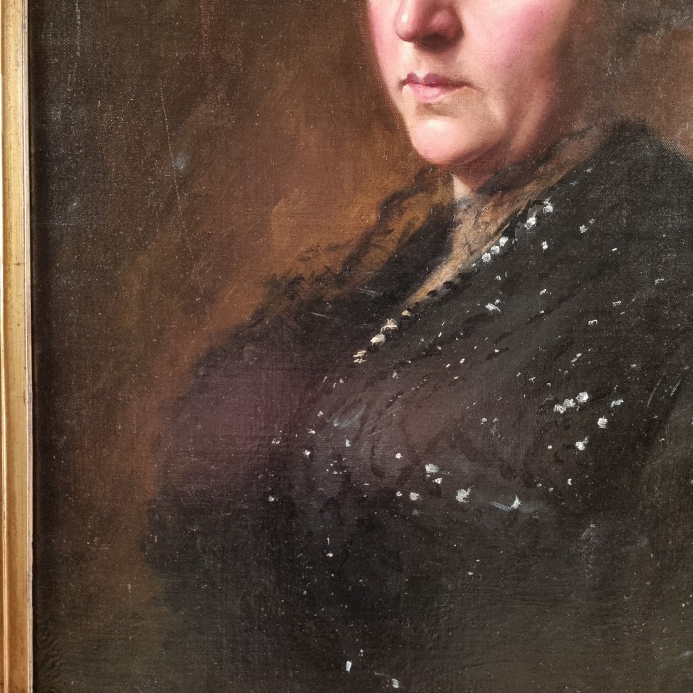 An Edwardian oil portrait of a lady framed in a wide burr wood moulding with a gilded inner border. View V