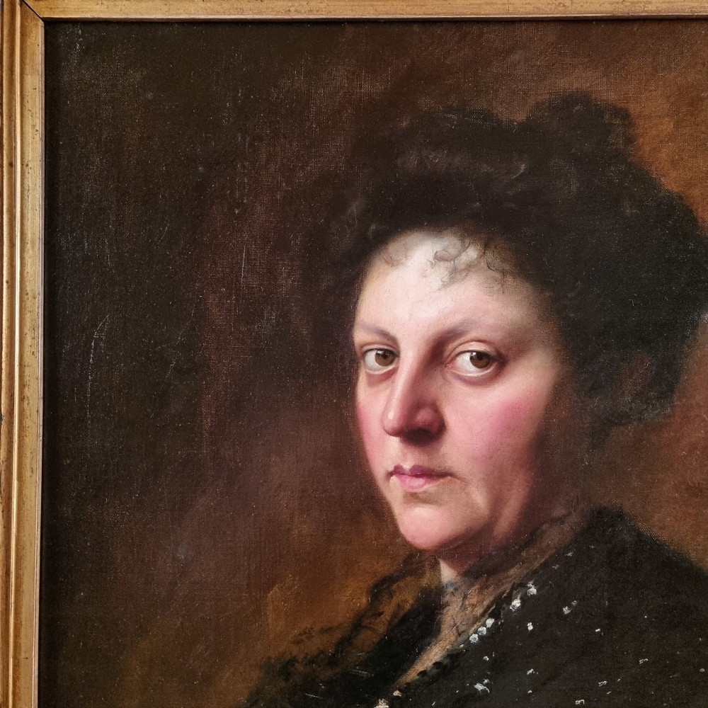 An Edwardian oil portrait of a lady framed in a wide burr wood moulding with a gilded inner border. View VI