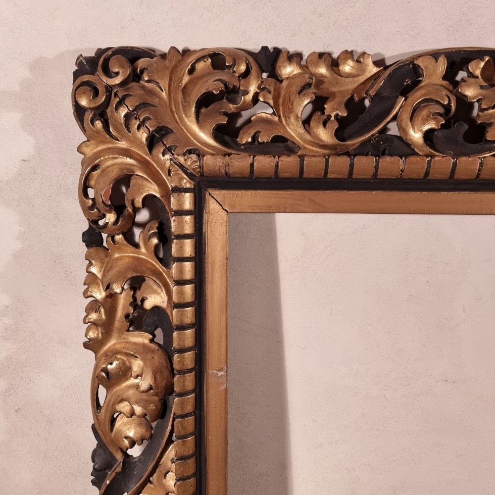 A large nineteenth-century rectangular giltwood frame featuring elaborate openwork acanthus leaf carvings and a gadrooned inner border. View III