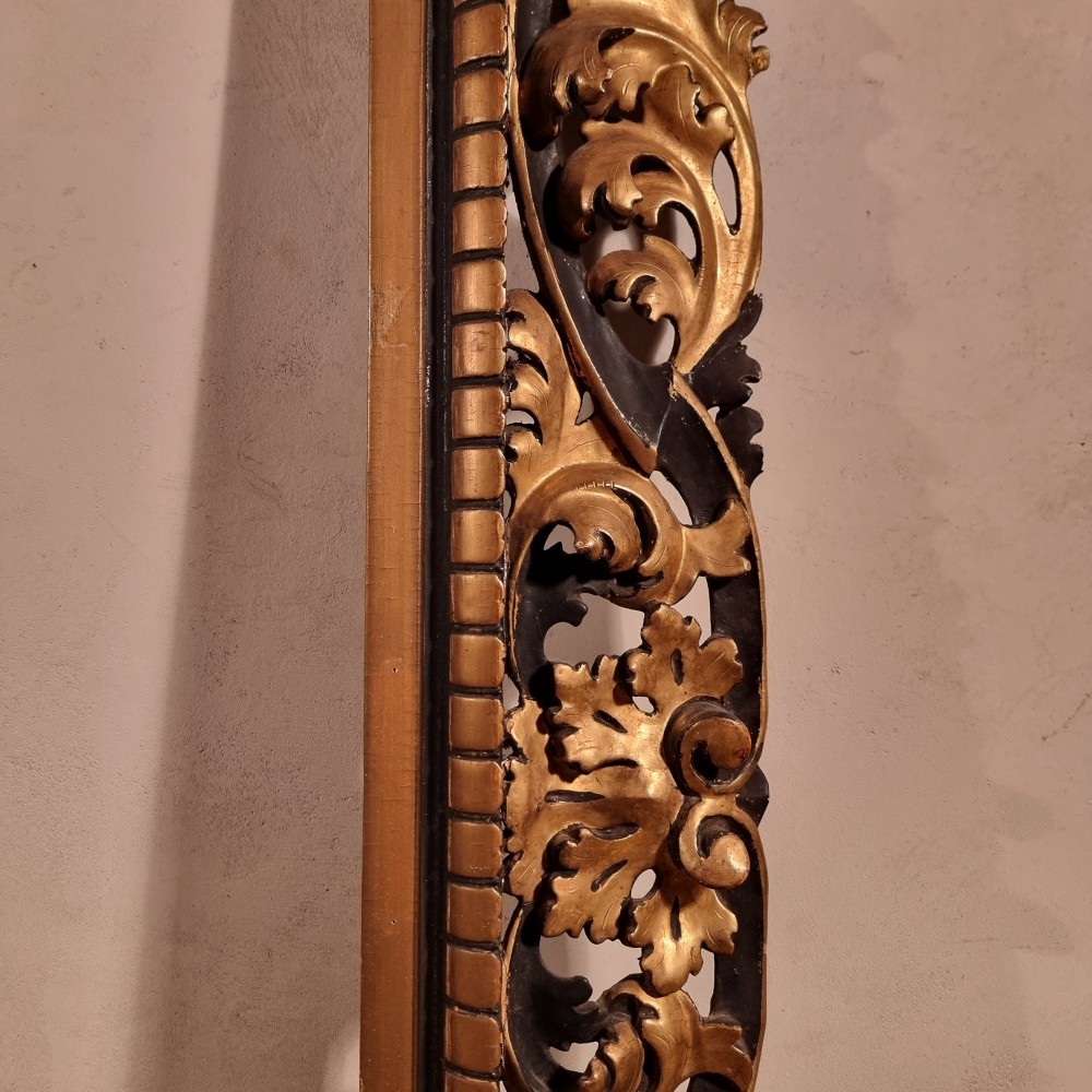 A large nineteenth-century rectangular giltwood frame featuring elaborate openwork acanthus leaf carvings and a gadrooned inner border. View VI