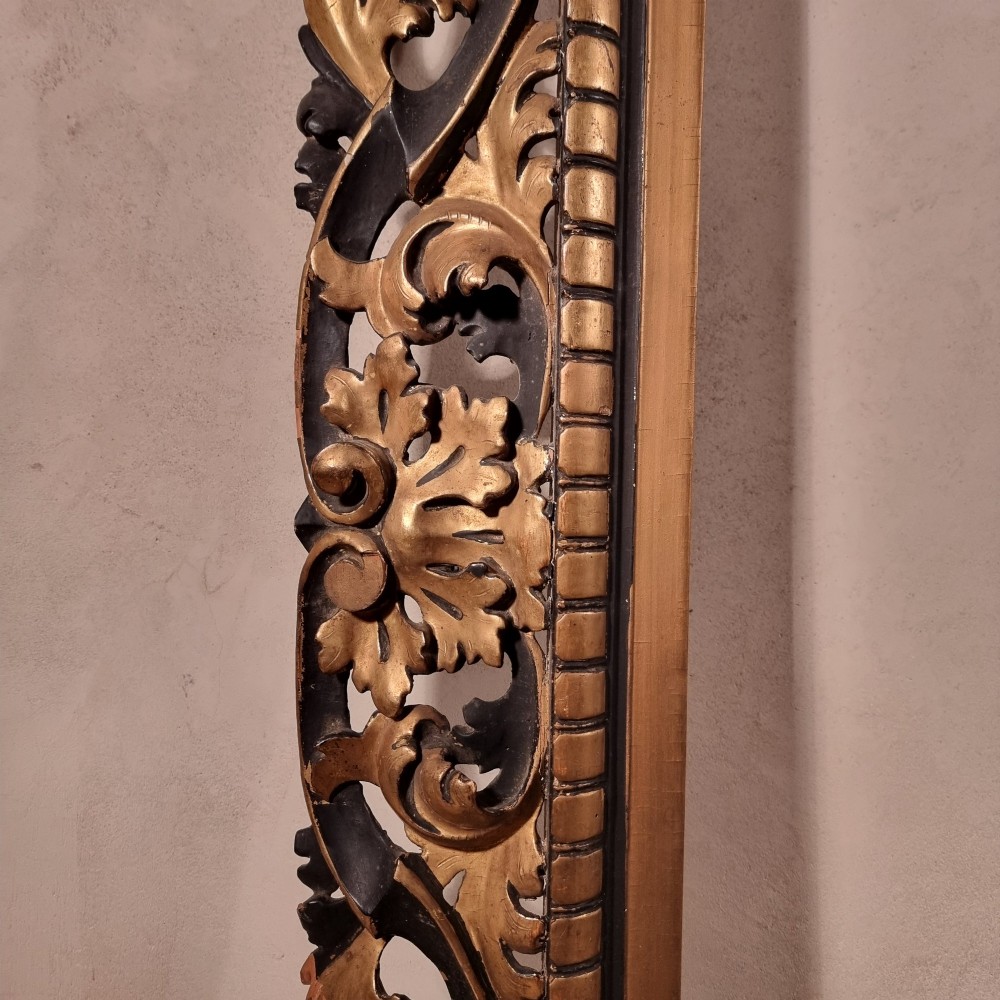 A large nineteenth-century rectangular giltwood frame featuring elaborate openwork acanthus leaf carvings and a gadrooned inner border. View X