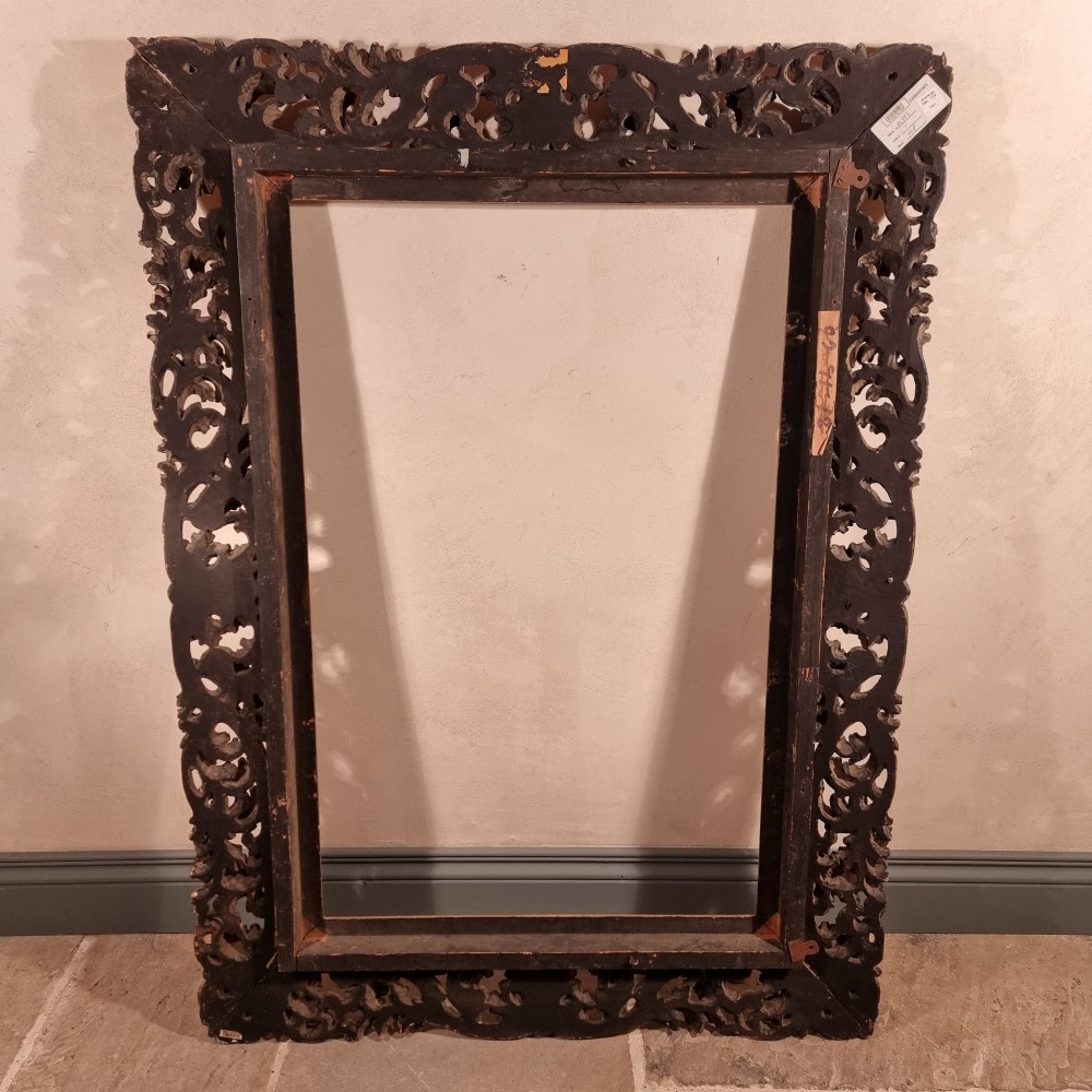 A large nineteenth-century rectangular giltwood frame featuring elaborate openwork acanthus leaf carvings and a gadrooned inner border. View XII
