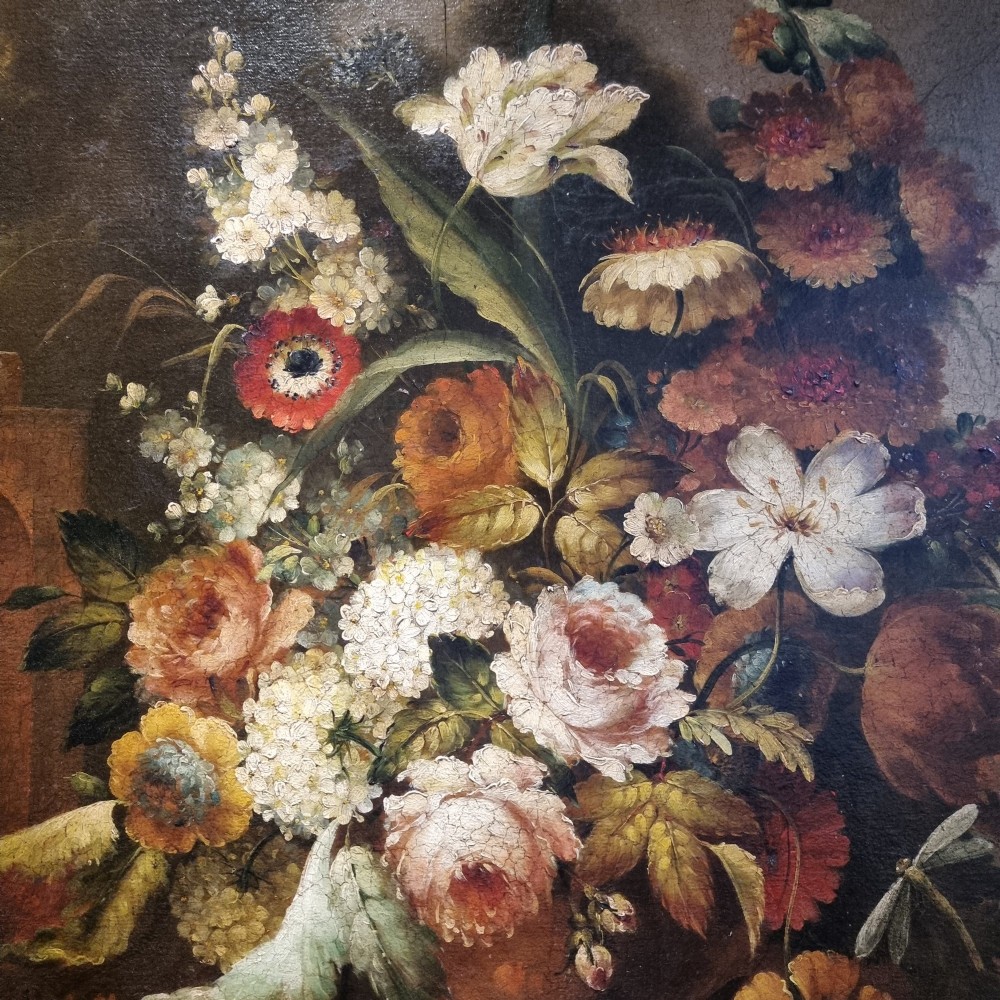 An 18th-century style oil painting on canvas depicting a floral arrangement in an urn with fruit at the base, housed within a gilded wooden frame. View V