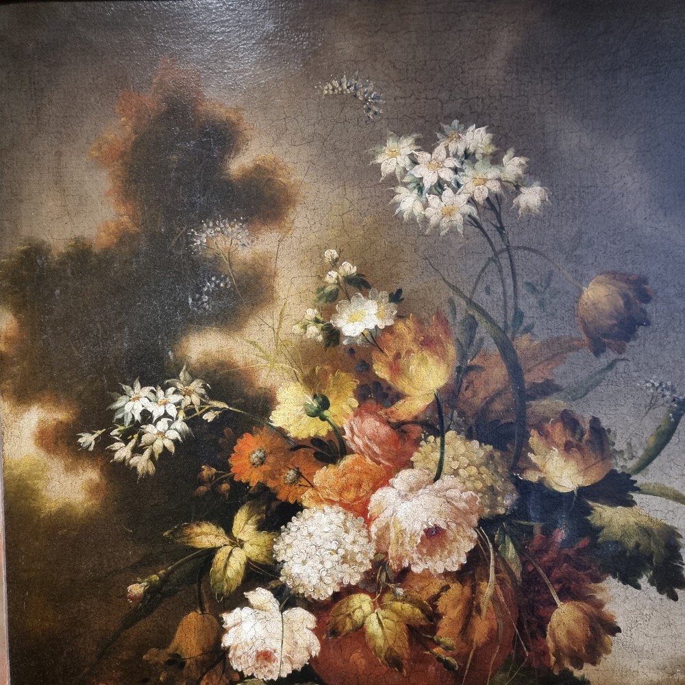 An 18th-century style oil painting on canvas depicting a floral arrangement in an urn with fruit at the base, housed within a gilded wooden frame. View IX