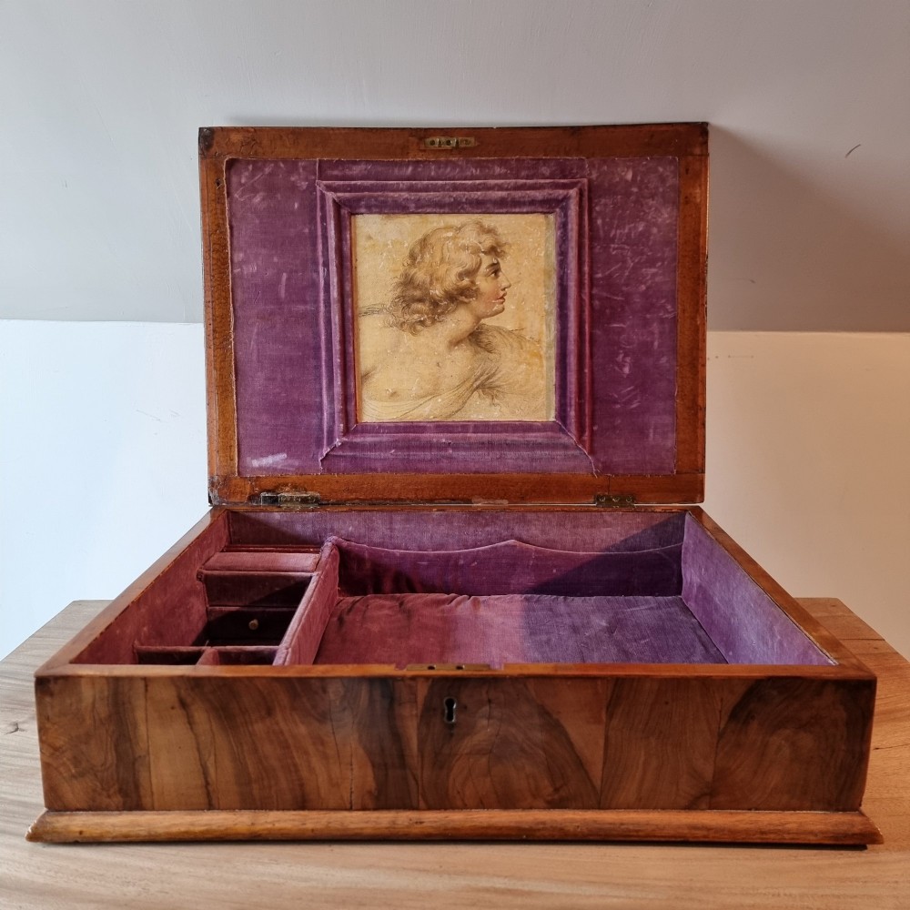 A rectangular William and Mary period walnut lace box featuring concentric oyster veneer patterns on the hinged lid. View II