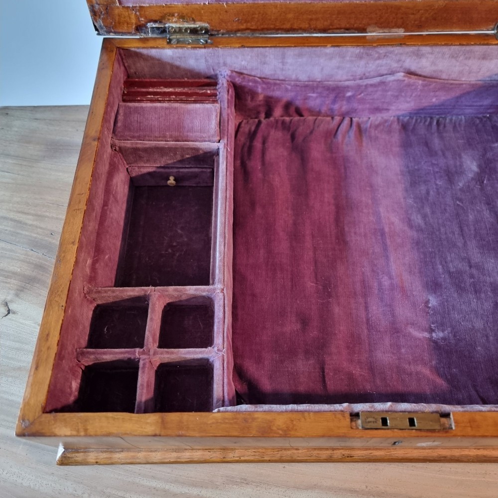 A rectangular William and Mary period walnut lace box featuring concentric oyster veneer patterns on the hinged lid. View V