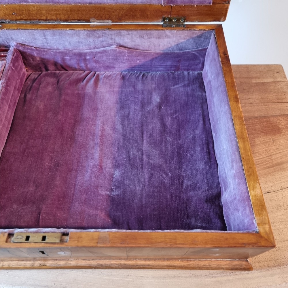 A rectangular William and Mary period walnut lace box featuring concentric oyster veneer patterns on the hinged lid. View VI