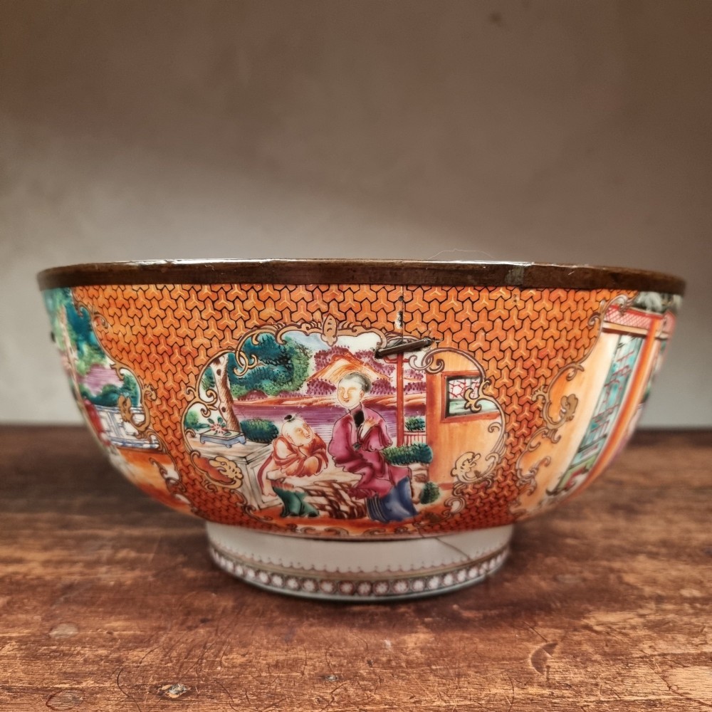 A 19th-century Chinese porcelain bowl featuring hand-painted polychrome figural scenes and a metal-bound rim. View III