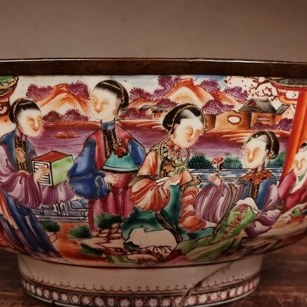A 19th-century Chinese porcelain bowl featuring hand-painted polychrome figural scenes and a metal-bound rim. View XI