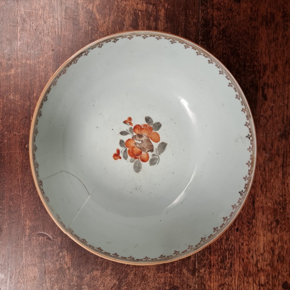 A 19th-century Chinese porcelain bowl hand-painted with polychrome enamels depicting figures in a garden landscape against an off-white background. View VIII