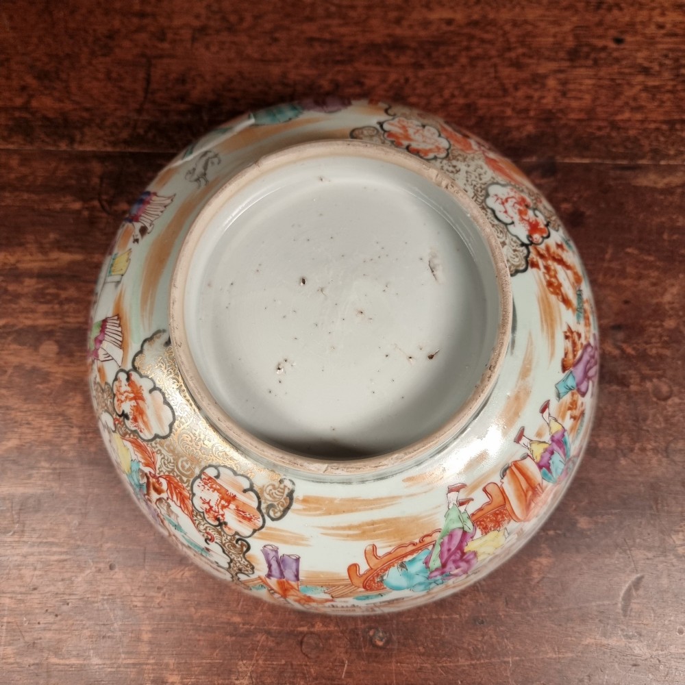 A 19th-century Chinese porcelain bowl hand-painted with polychrome enamels depicting figures in a garden landscape against an off-white background. View IX