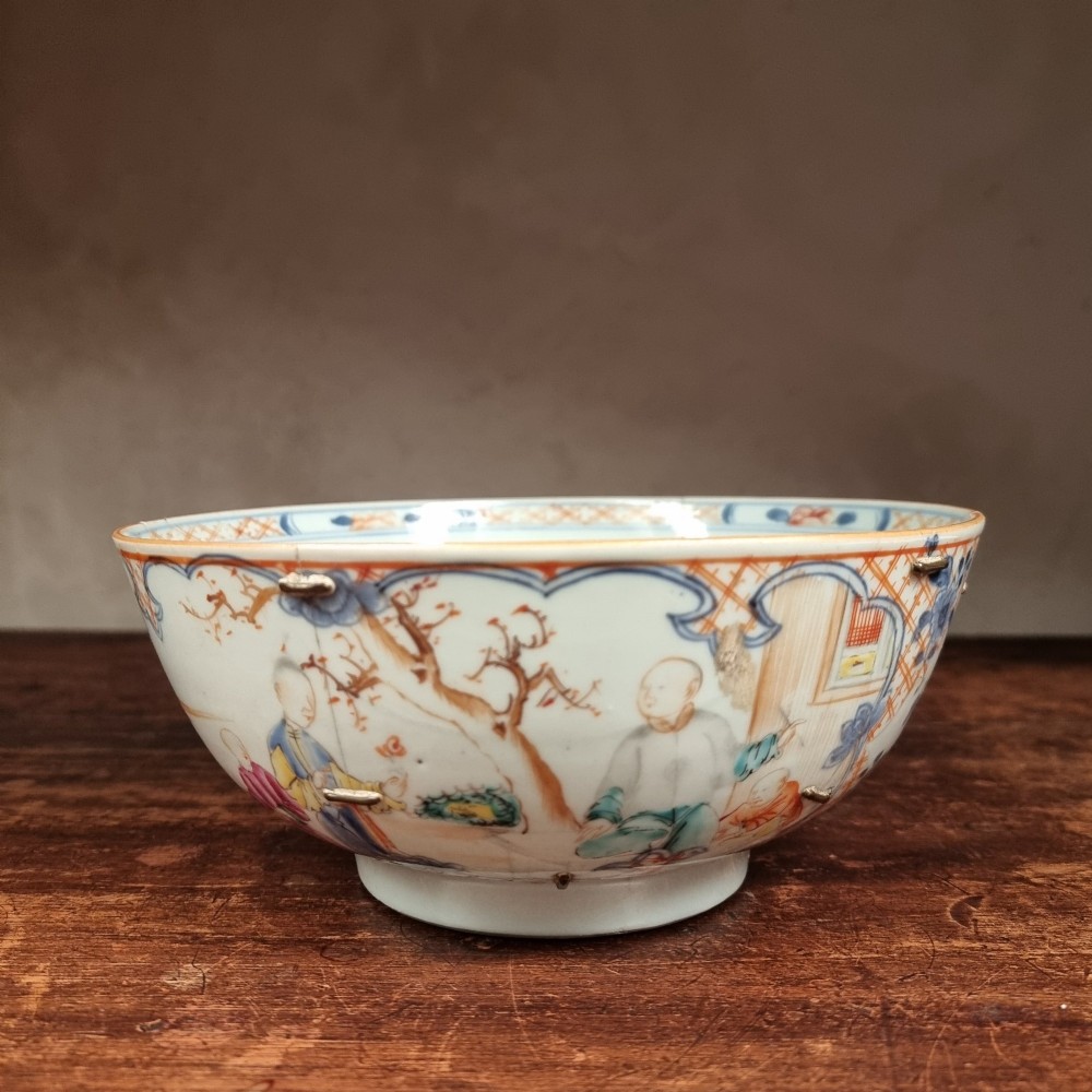 A 19th-century footed Chinese porcelain bowl featuring hand-painted figurative scenes in polychrome enamels with red lattice borders. View II