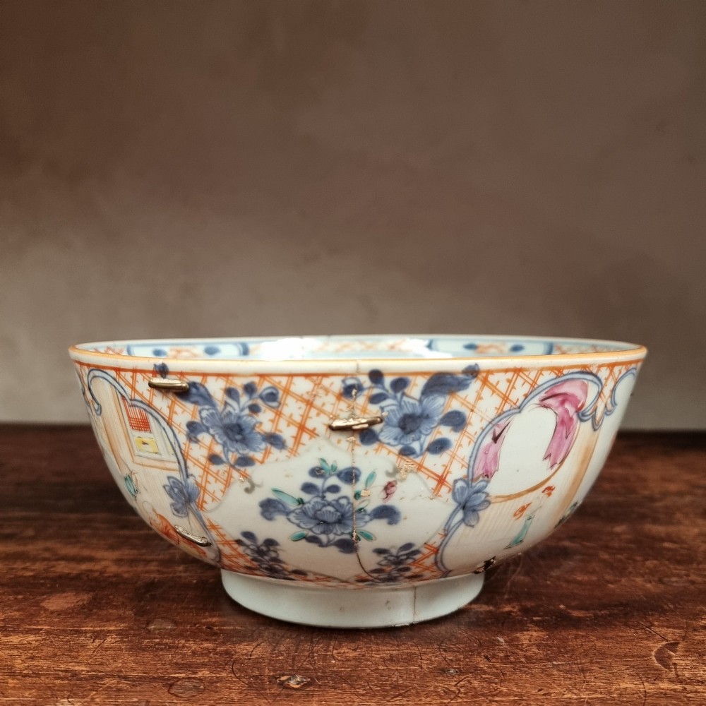 A 19th-century footed Chinese porcelain bowl featuring hand-painted figurative scenes in polychrome enamels with red lattice borders. View VI