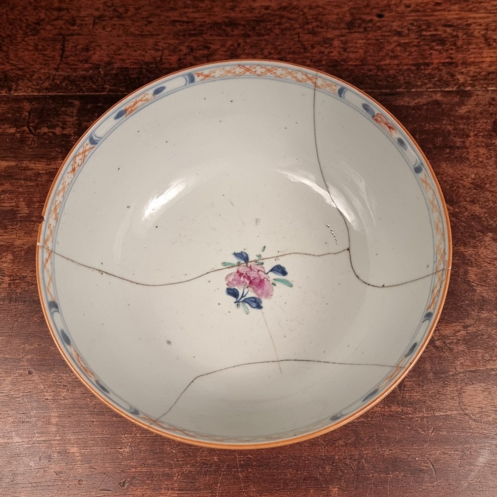A 19th-century footed Chinese porcelain bowl featuring hand-painted figurative scenes in polychrome enamels with red lattice borders. View VII