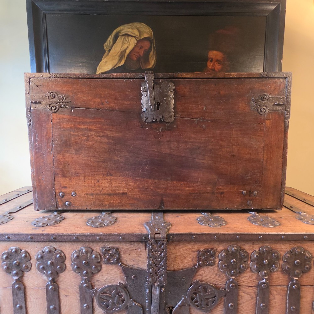 A seventeenth-century dark walnut fall-front table cabinet featuring multiple drawers decorated with intricate geometric and scrollwork wood inlays around an architectural central door. View II