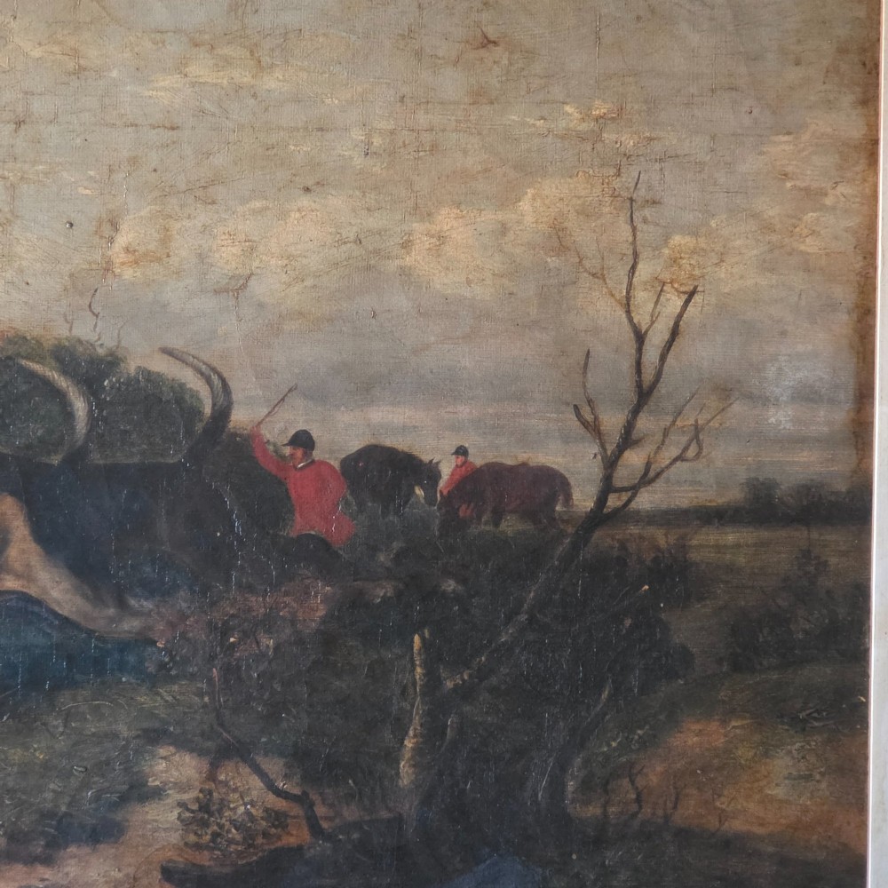 A 19th-century horizontal oil painting on canvas depicting a pack of hunting hounds in a rural landscape, set within an ornate carved gilt frame. View II