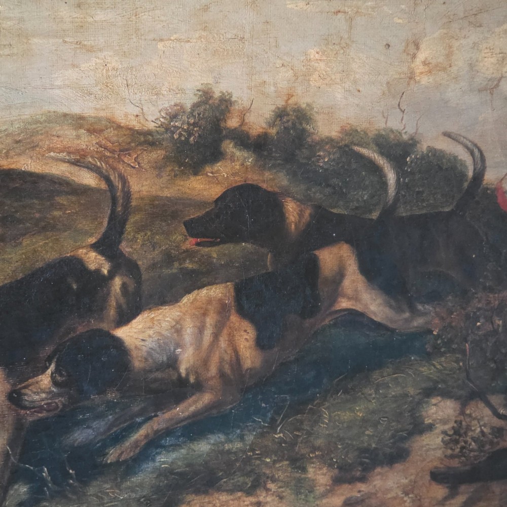 A 19th-century horizontal oil painting on canvas depicting a pack of hunting hounds in a rural landscape, set within an ornate carved gilt frame. View III