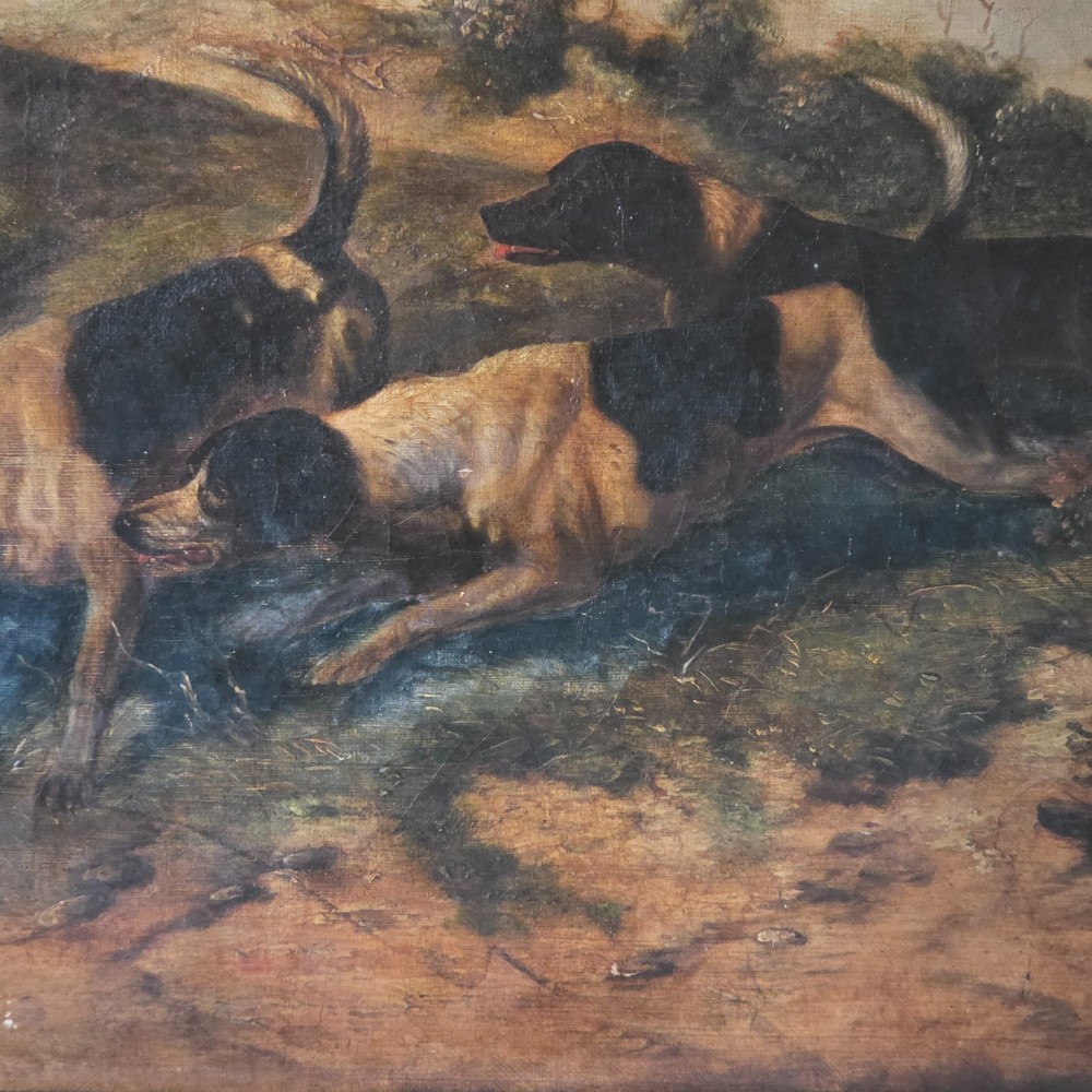 A 19th-century horizontal oil painting on canvas depicting a pack of hunting hounds in a rural landscape, set within an ornate carved gilt frame. View VII