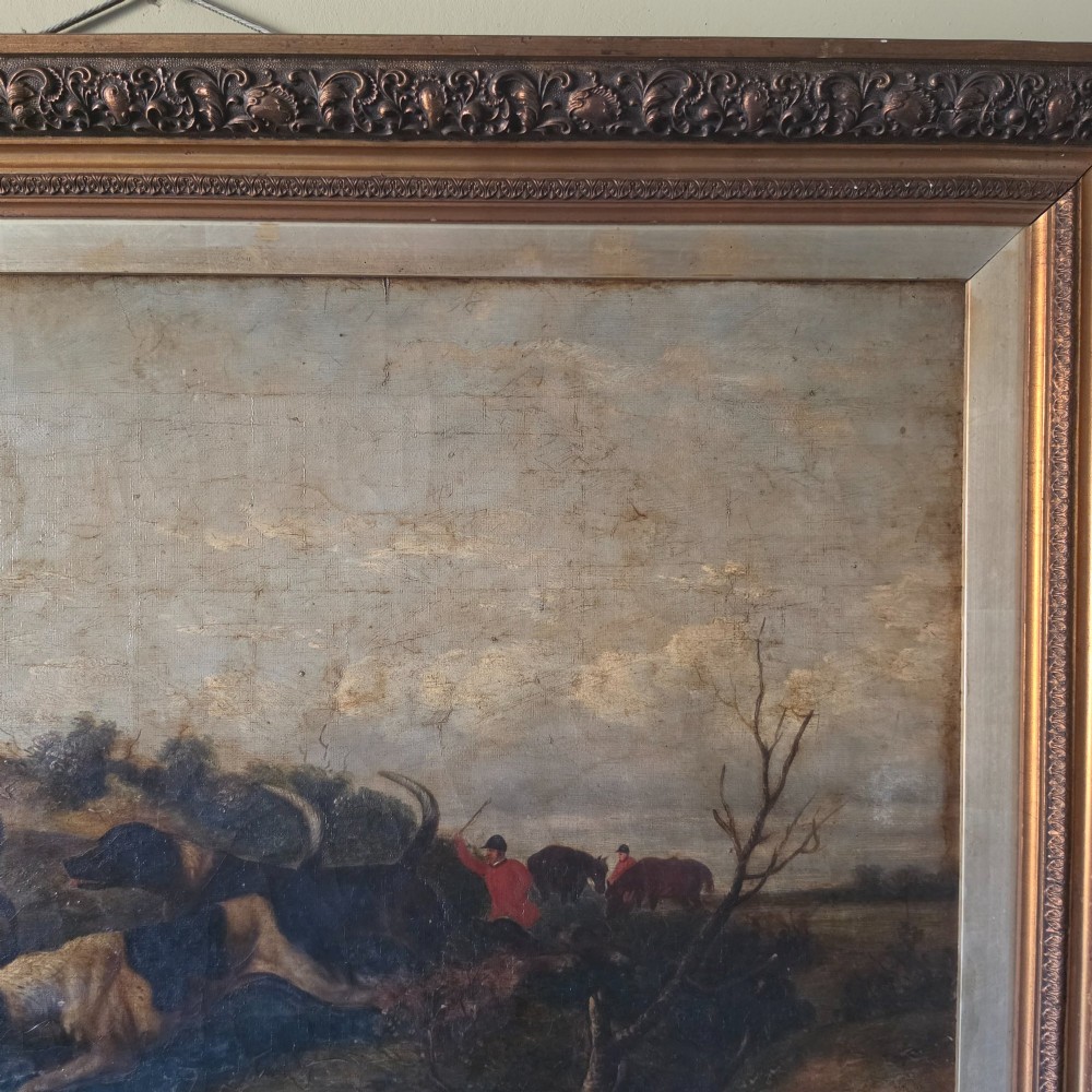 A 19th-century horizontal oil painting on canvas depicting a pack of hunting hounds in a rural landscape, set within an ornate carved gilt frame. View VIII