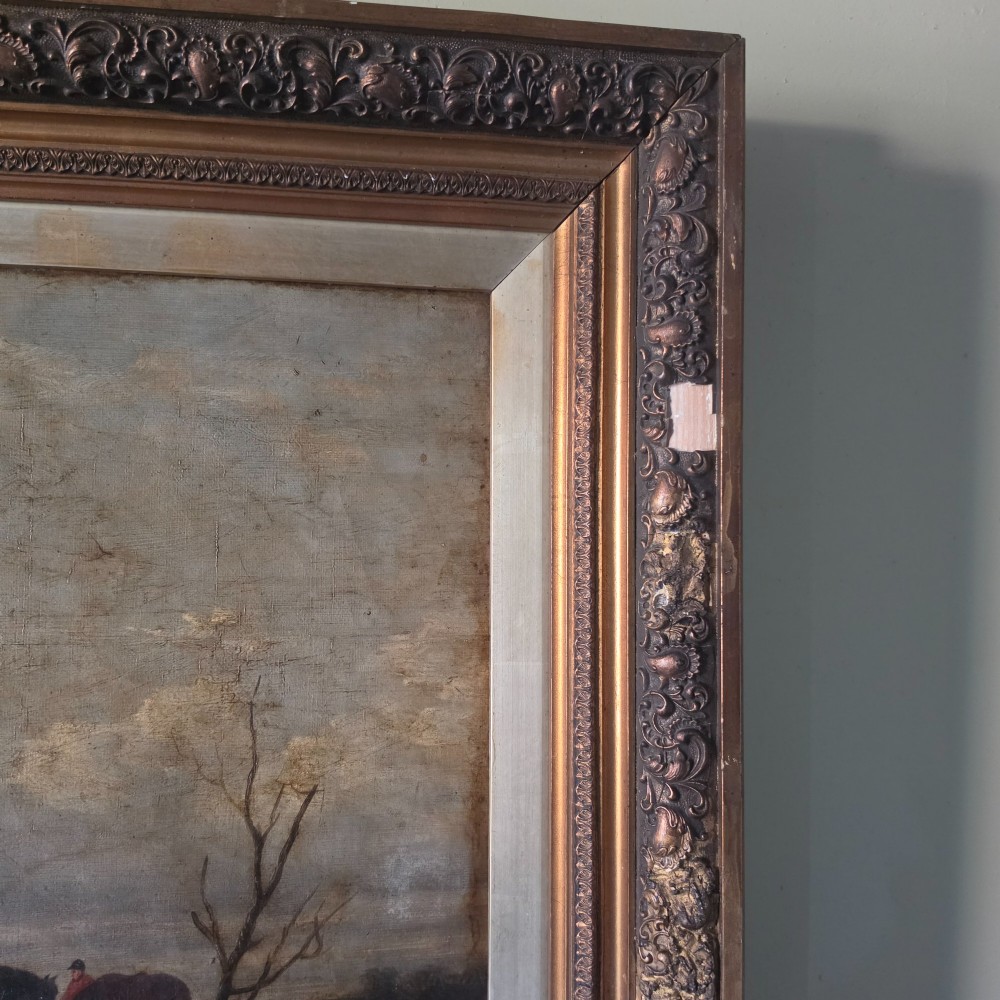A 19th-century horizontal oil painting on canvas depicting a pack of hunting hounds in a rural landscape, set within an ornate carved gilt frame. View XI