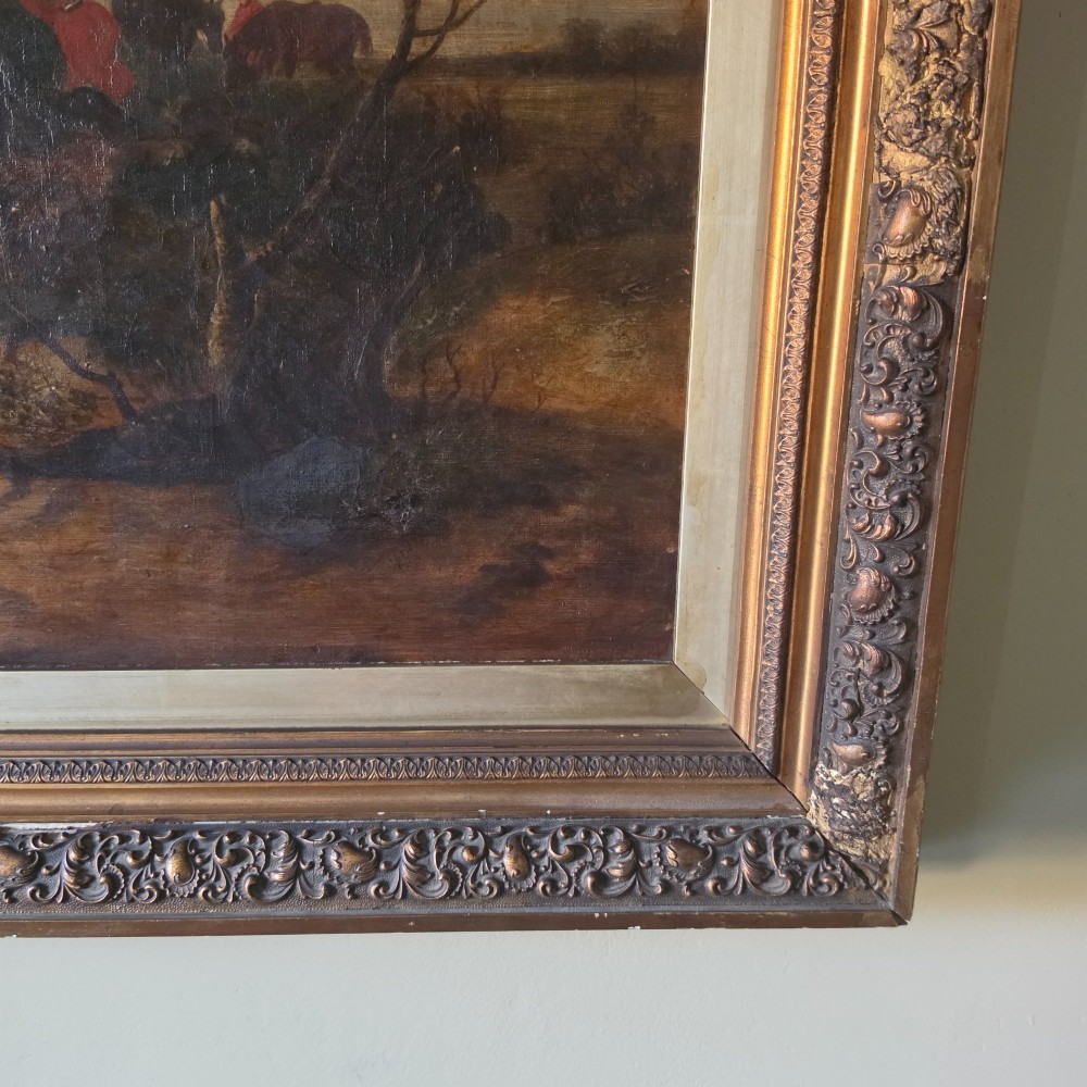 A 19th-century horizontal oil painting on canvas depicting a pack of hunting hounds in a rural landscape, set within an ornate carved gilt frame. View XIII