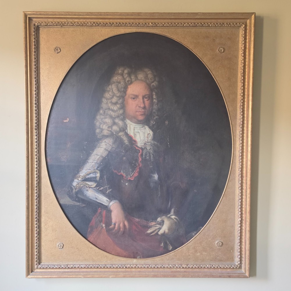 A large late 17th century portrait of a gentleman in armour.