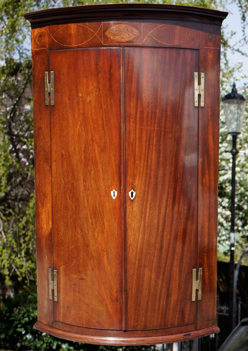 mahogany bow fronted inlaid corner cupboard - CATEGORY: ANTIQUE CUPBOARDS - DATED 1800