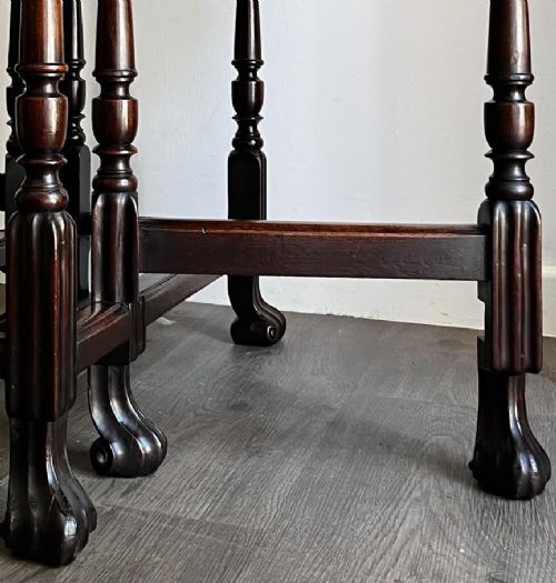 A dark mahogany Georgian drop flap dining table with turned gatelegs and feet. View III