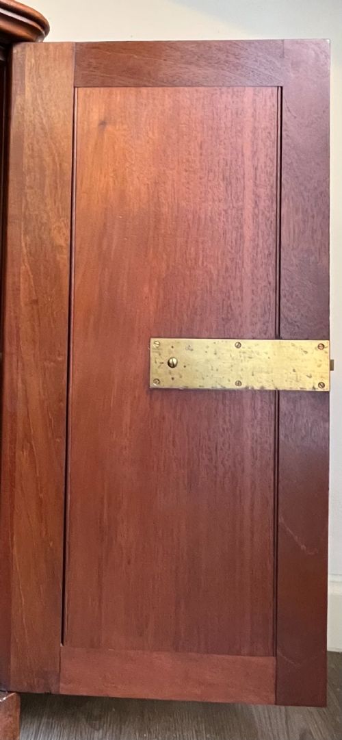 A Victorian warm brown timber pot cupboard featuring a single fielded panel door with a carved central wooden knob and a sturdy plinth base. View VI