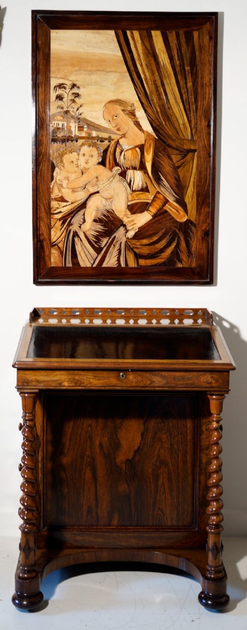 An antique dark rosewood Davenport desk featuring a slanted black leather writing surface, pierced gallery top, side drawers, and turned barley twist front columns. View IX