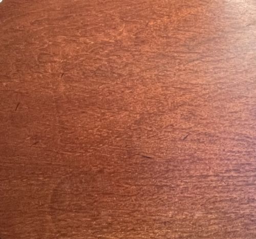 fig 1. A mahogany tilt-top tripod table shown with its top positioned vertically, revealing a turned central column and cabriole legs.