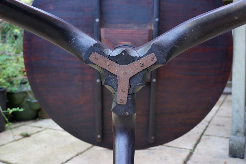 A Georgian mahogany tripod table featuring a circular top, turned carved column, and three cabriole legs. View VI