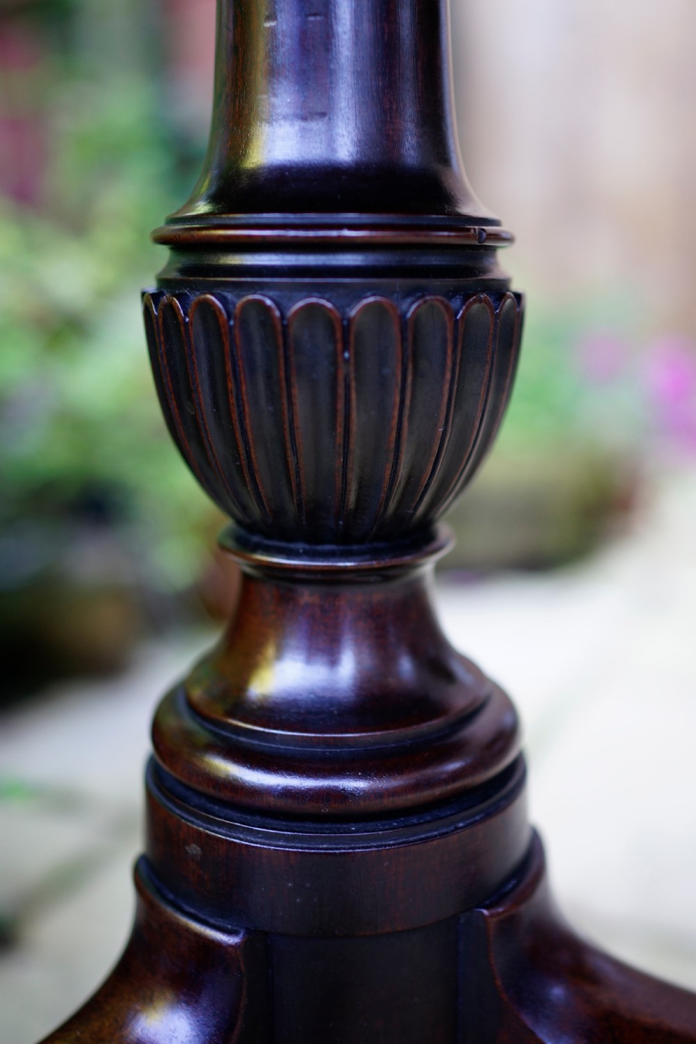 A Georgian mahogany tripod table featuring a circular top, turned carved column, and three cabriole legs. View VIII