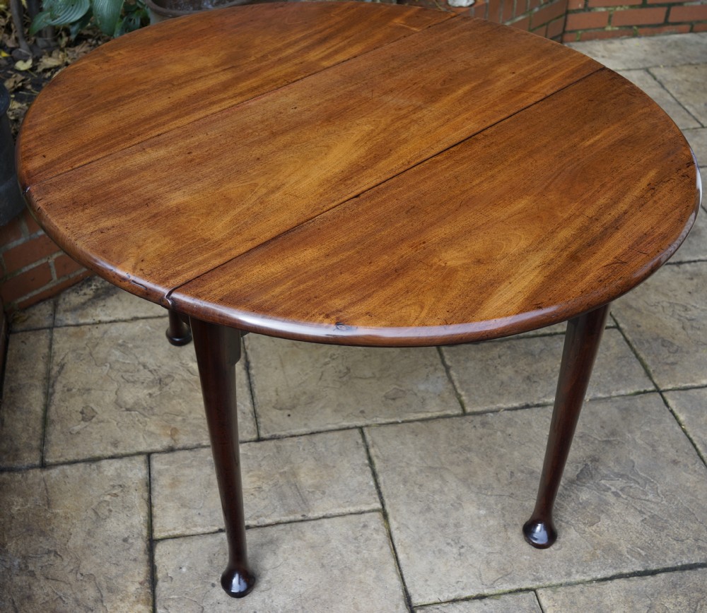 A three plank George 3rd mahogany pad foot gate leg dining table