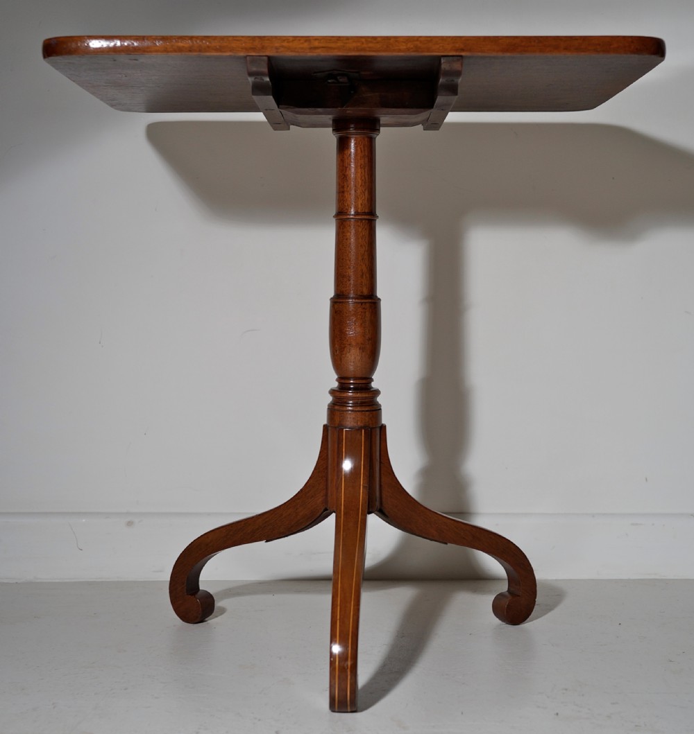 Mahogany tilt top tripod table with boxwood stringing to legs in excellent condition