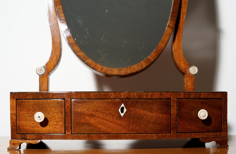 Mahogany bow fronted and inlaid three-drawer mirror with attractive shield shaped mirror View II