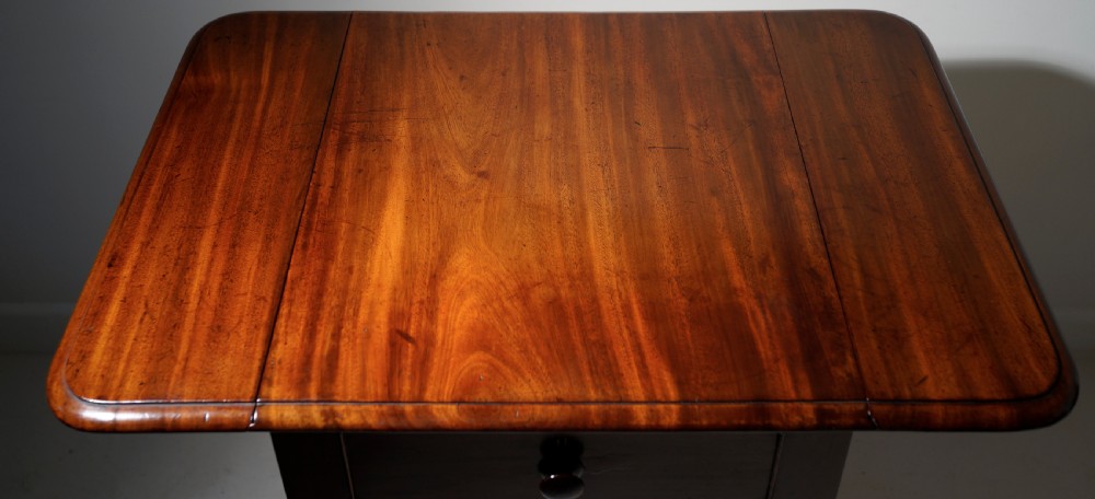 A good quality nicely figured solid mahogany drop flap centre support occasional table in excellent  View III