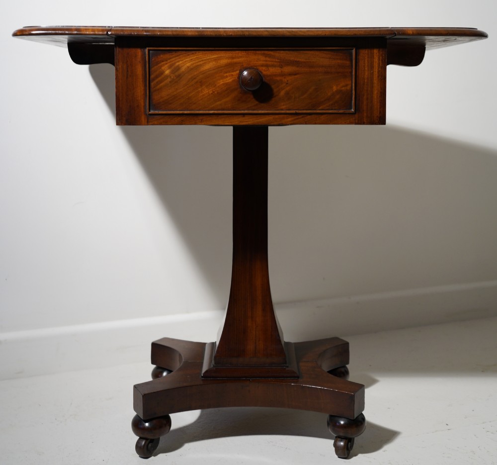 A good quality nicely figured solid mahogany drop flap centre support occasional table in excellent 