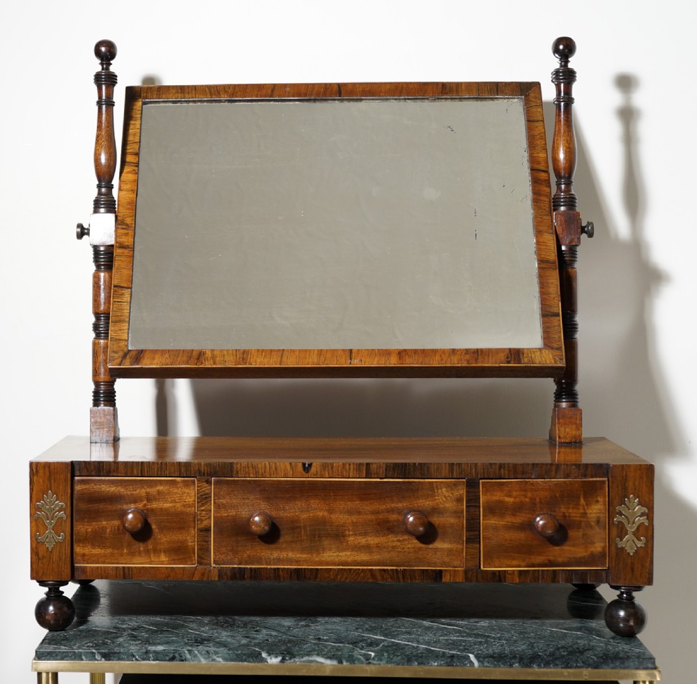 A good Regency three-drawer oak lined mahogany and rosewood with boxwood stringing toilet mirror.