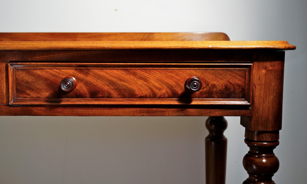 Victorian 1860s mahogany table with two drawers supported on four turned tapering legs. View III